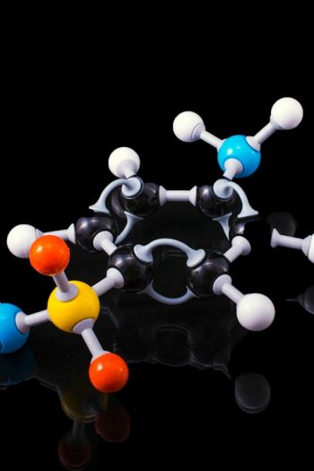 3D molecular model representing a chemical compound against a black background