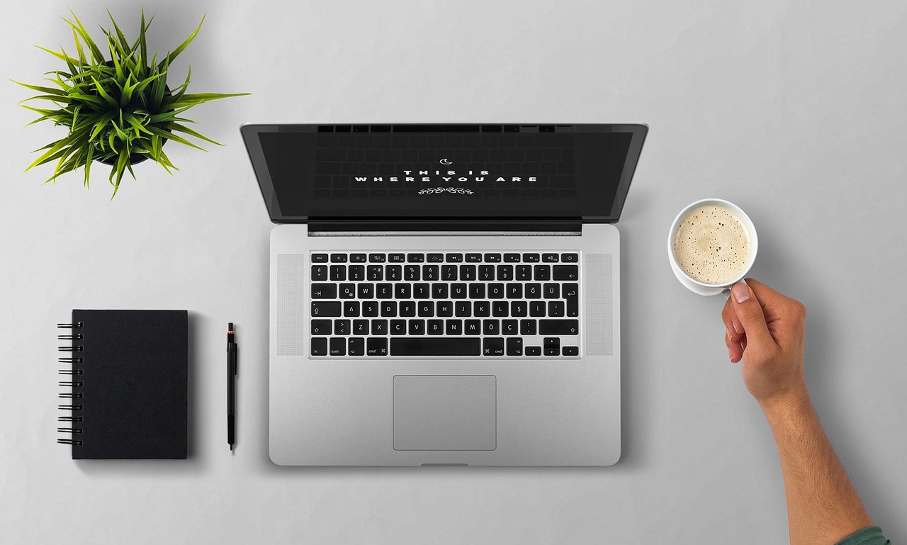 Laptop, coffee, arm — "All-Inclusive Comfort: Twin Over Full Beds Tailored for Both Adults and Kids"