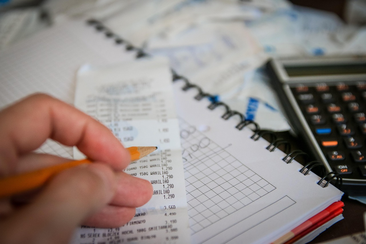 Money, bills, calculator — California Living Shield: Your Comprehensive Guide to Renters Insurance