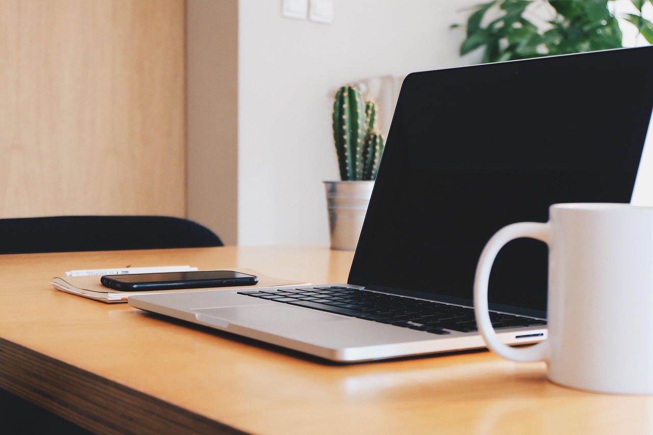 Office, desk, coffee cup — Ensure Consistent SEO Results by Partnering with a White Label SEO Agency