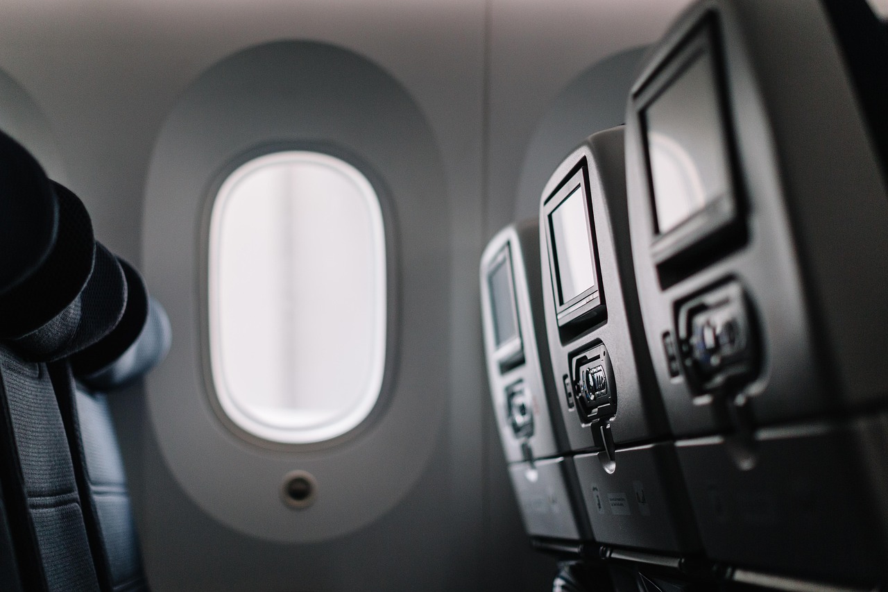 Plane, seats, window — Reasons You should have a Server Booster