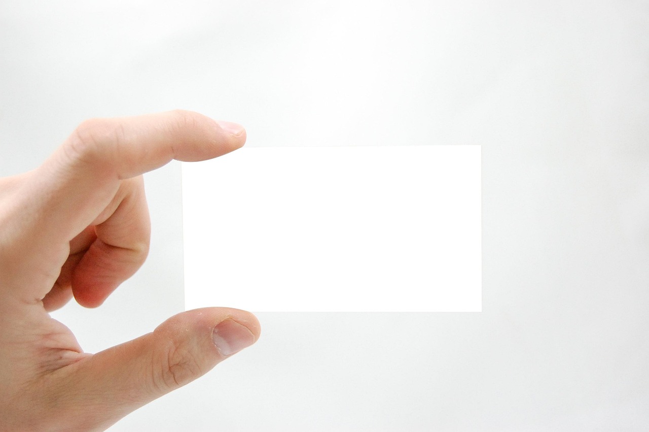 Business card, business, hand — The Benefits of Hiring an Attorney from Deladurantey Attorney at Law for Your Case