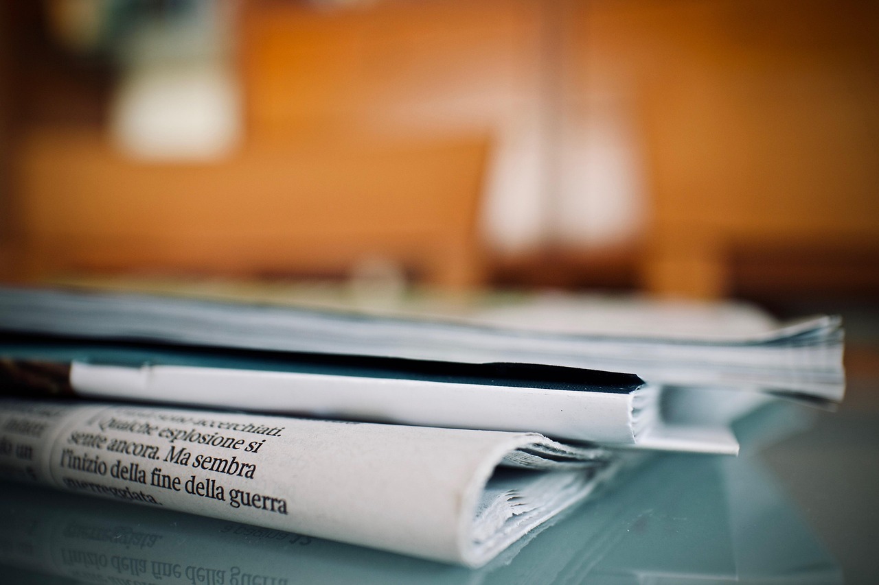 Newspapers, weekly, reading — Transforming Dreams into Reality: Professional Immigration Consultants in Edmonton