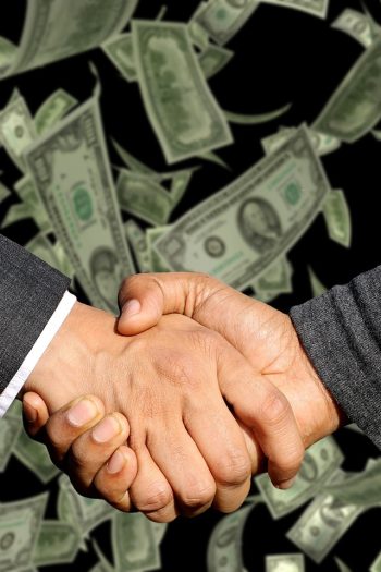 Handshake, agreement, trade — Unlocking Business Potential with Andrew Hillman Strategic Vision