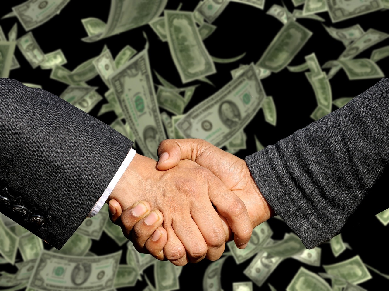 Handshake, agreement, trade — Unlocking Business Potential with Andrew Hillman Strategic Vision