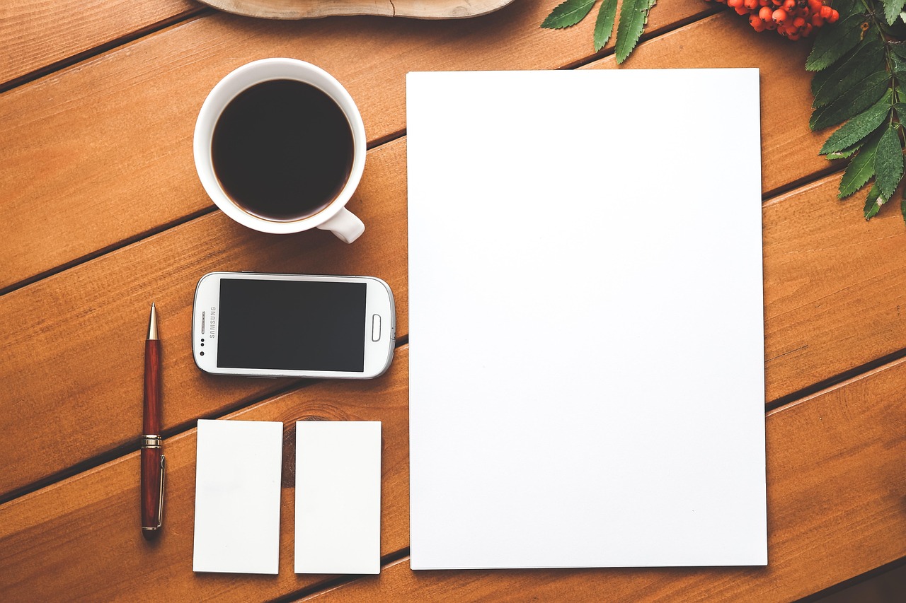 Coffee, phone, paper — Unlocking the Therapeutic Benefits of CBD Drops